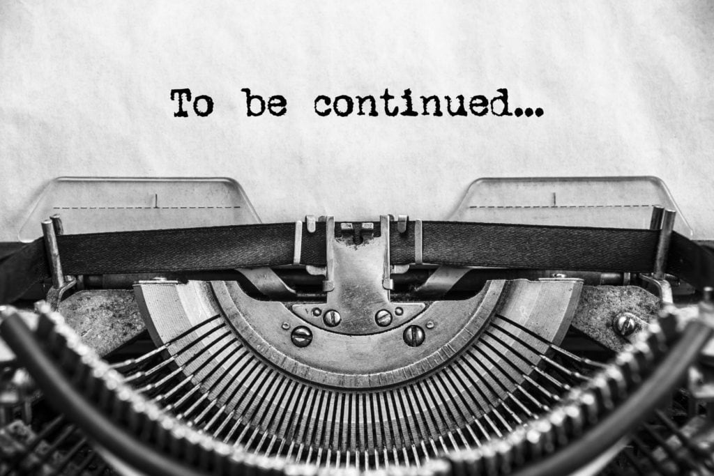 To be continued... typed text on a vintage typewriter. old paper. Close up image of just the mechanism and the words.