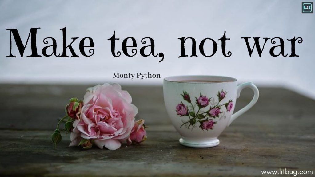 Pink rose and a teacup covered in pink roses on a worn wood table under the text "Make tea, not war (Monty Python)"